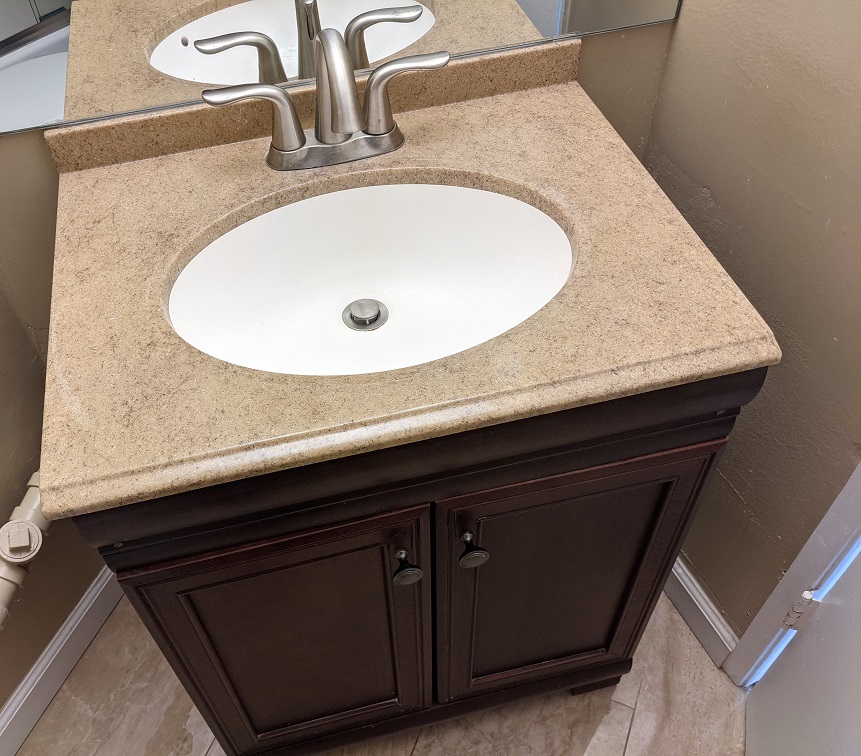 The countertop and sink in the second bathroom