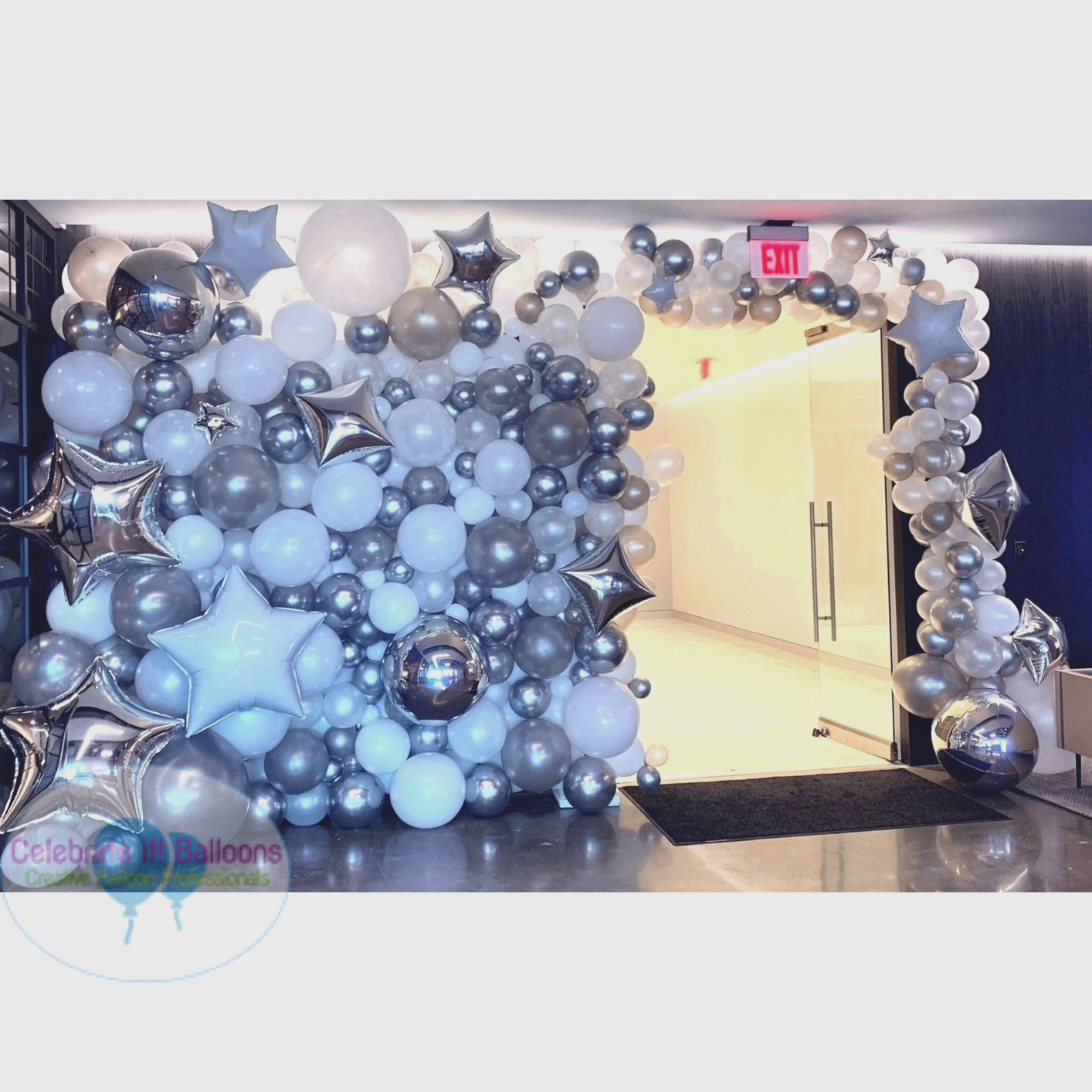 white and silver organic balloon wall with star balloon accents