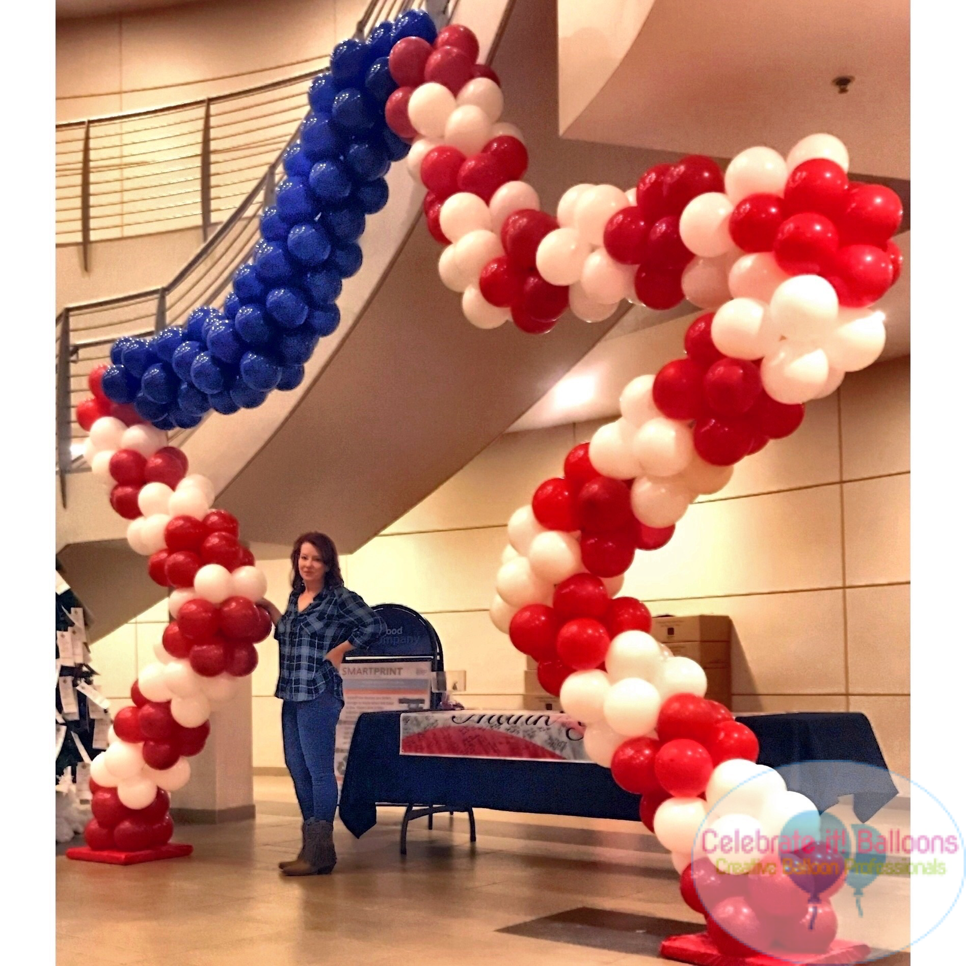 Large star shaped balloon arch in red, white and blue