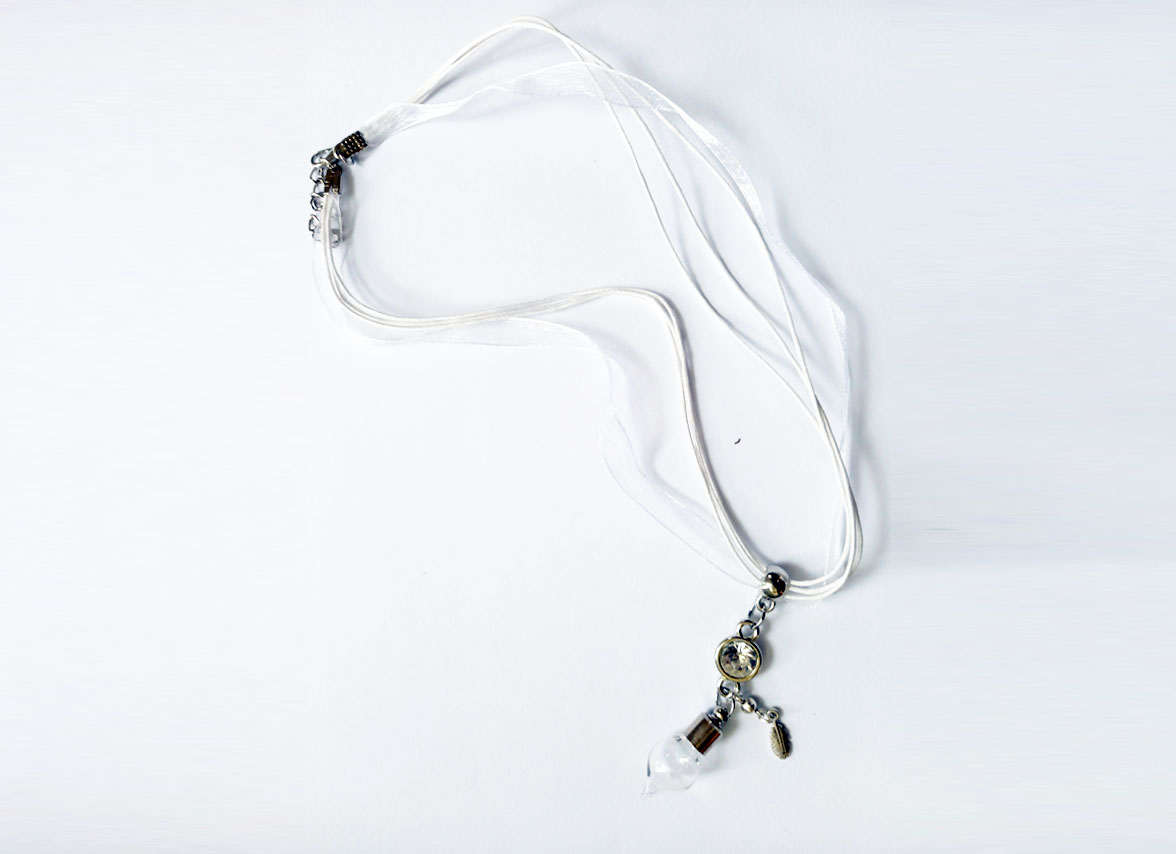 White Feather - Charmed Pendant filled with St.Brigid Well Water from an Irish Holy Well.