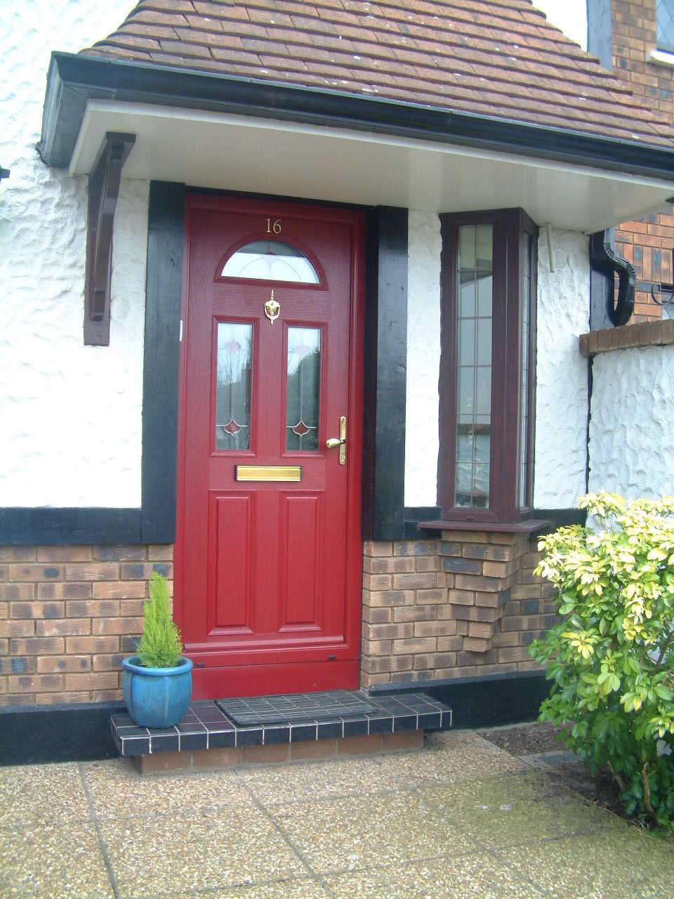 RED APEER COMPOSITE FRONT DOOR FITTED BY ASGARD WINDOWS DUBLIN.