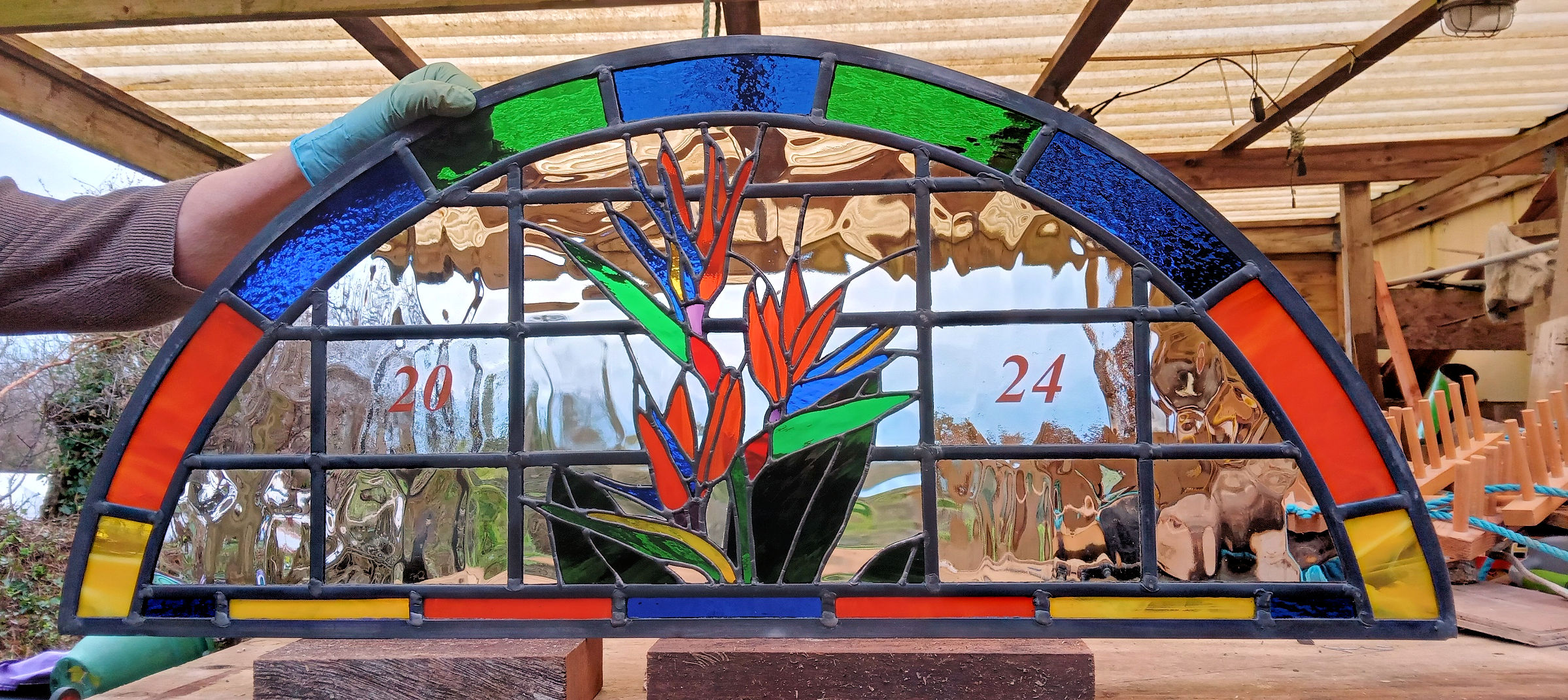 Panel depicts a colourful Bird of Paradise flower with matching border.