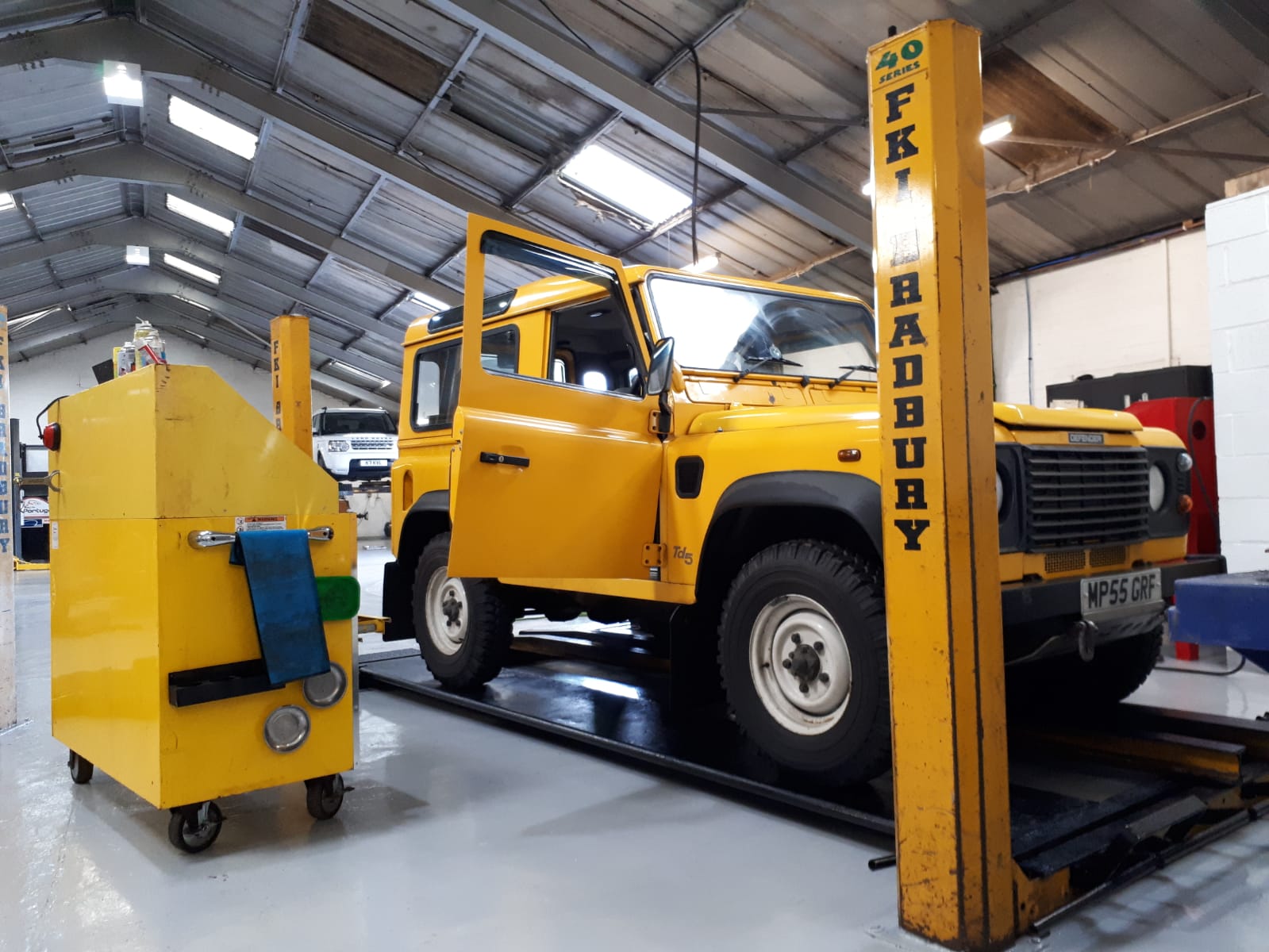 Land Rover Defenders in the Gibsons Auto Services workshop in Cumnock Ayrshire