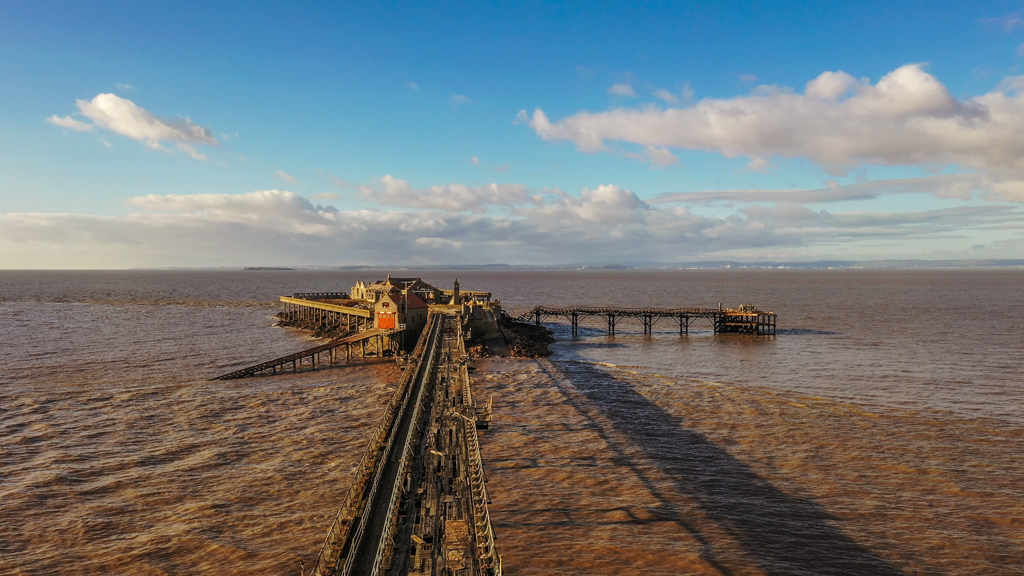 Aerial sequence depicting Birnbeck Pier at Weston-super-Mare, built in 1867 and currently derelict.