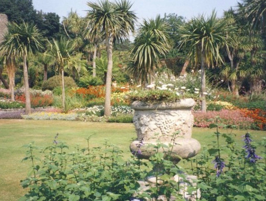 Palm trees and a flower urn at Logan Royal Botanic Gardens, Dumfries and Galloway