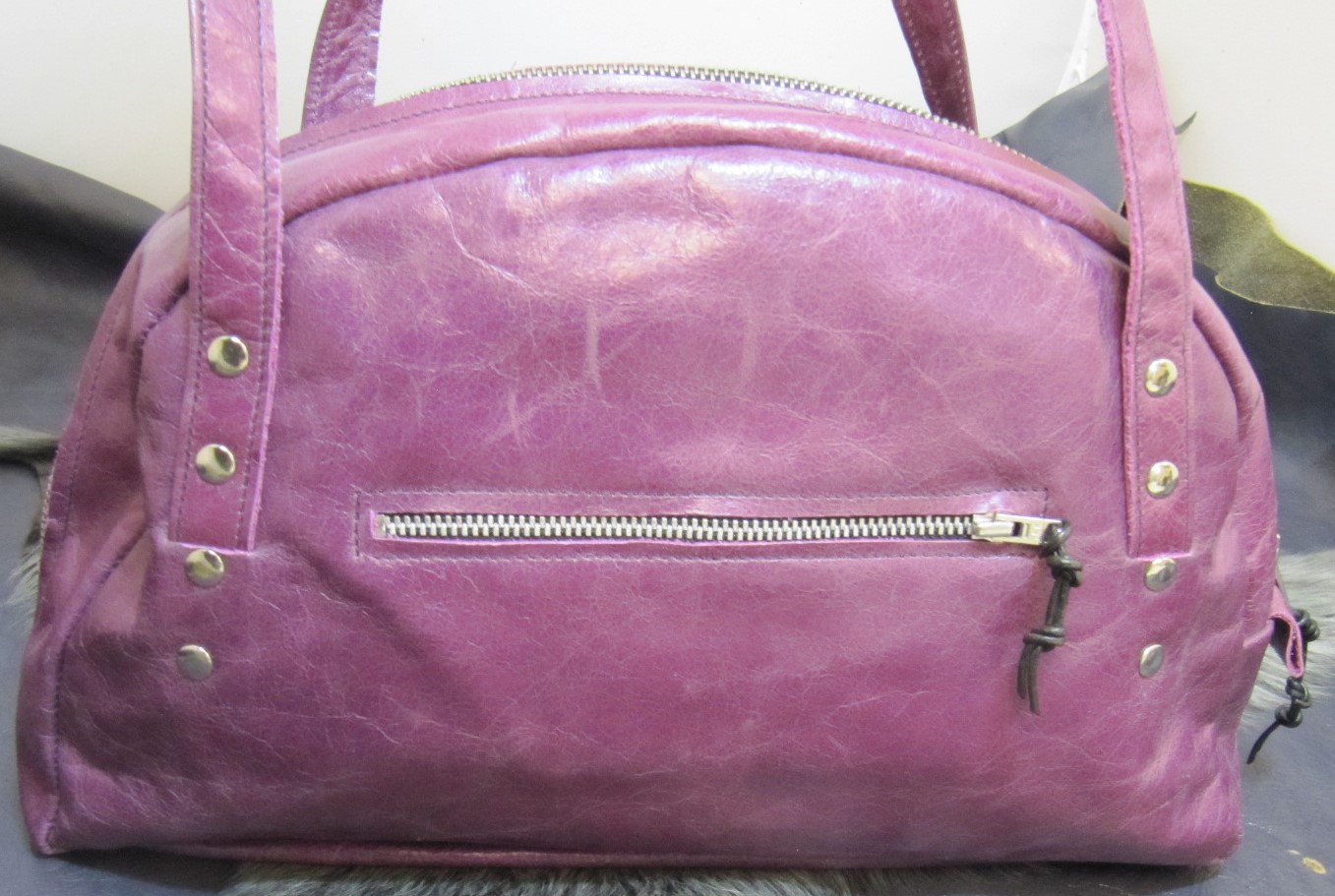 Purple leather half moon handbag