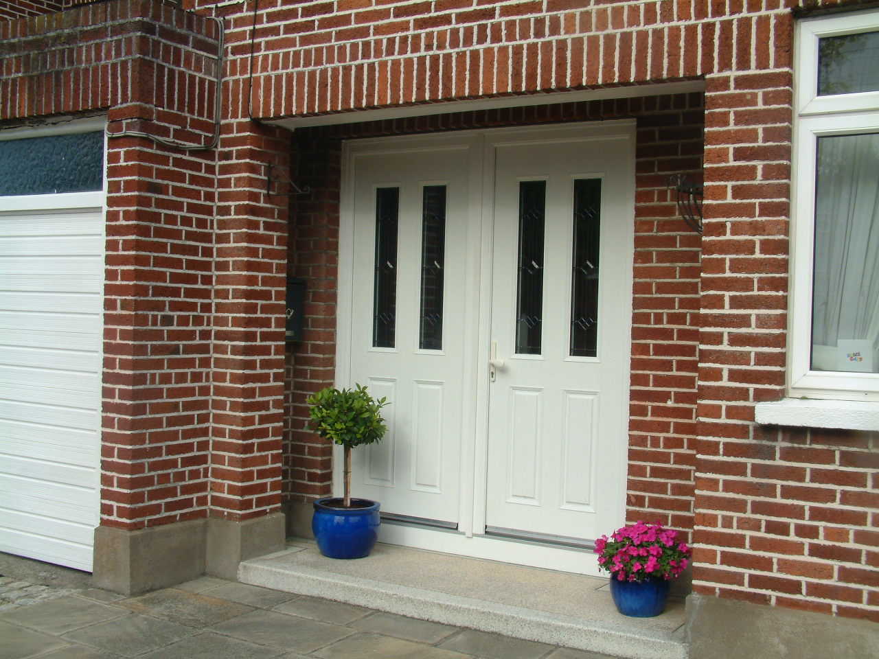 WHITE APEER APM2 COMPOSITE FRONT DOOR FITTED BY ASGARD WINDOWS IN DUBLIN.