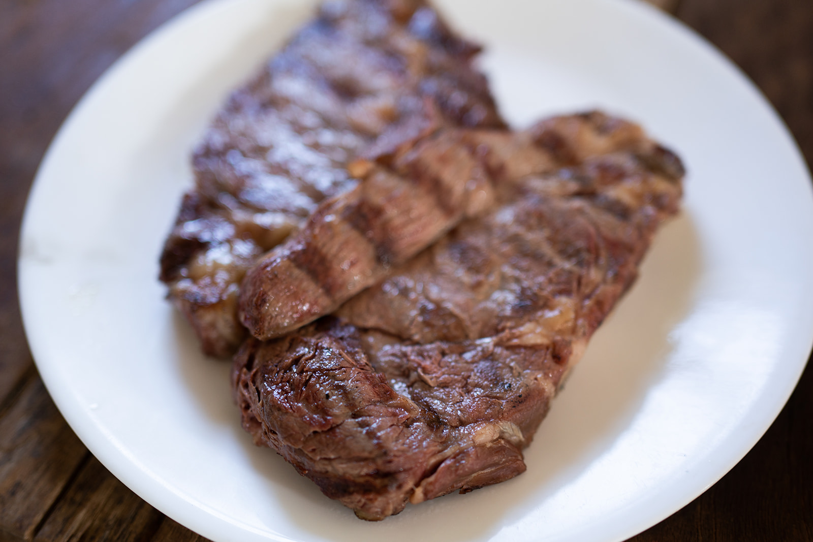 A barbequed Boneless Ribeye with grill marks.