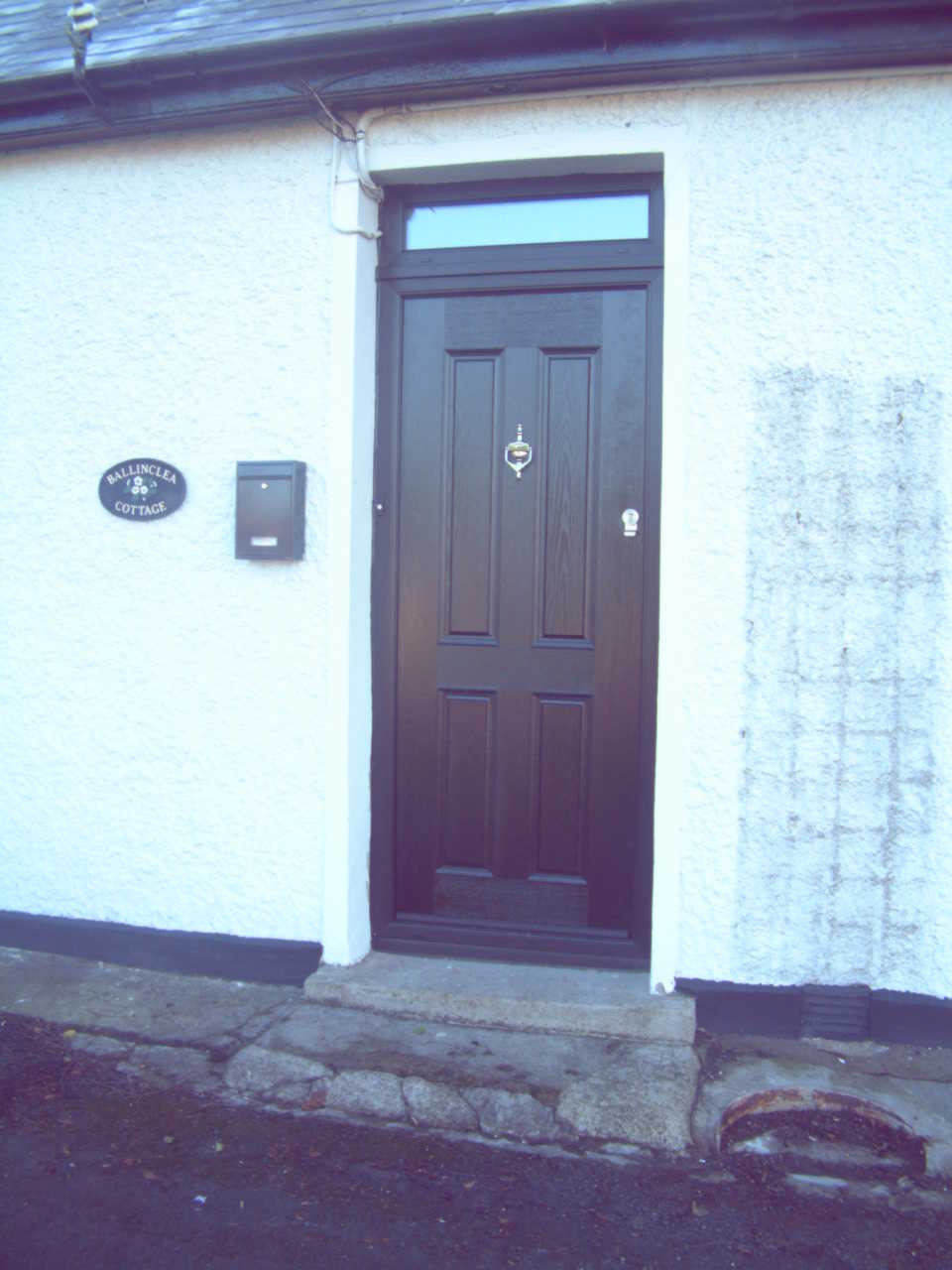 BLACK APEER APM1 FRONT DOOR FITTED BY ASGARD WINDOWS IN DUBLIN.
