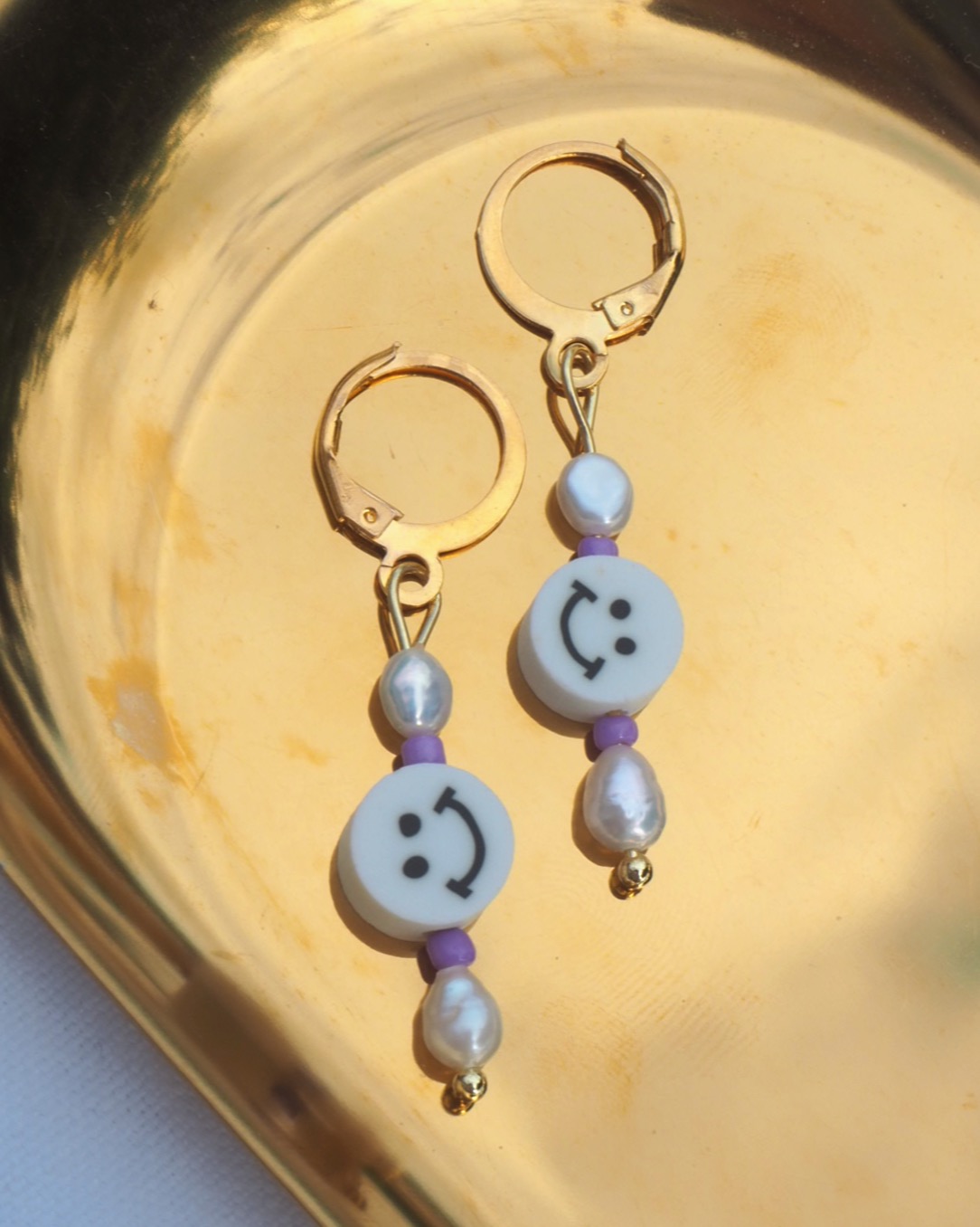 purple smiley earrings