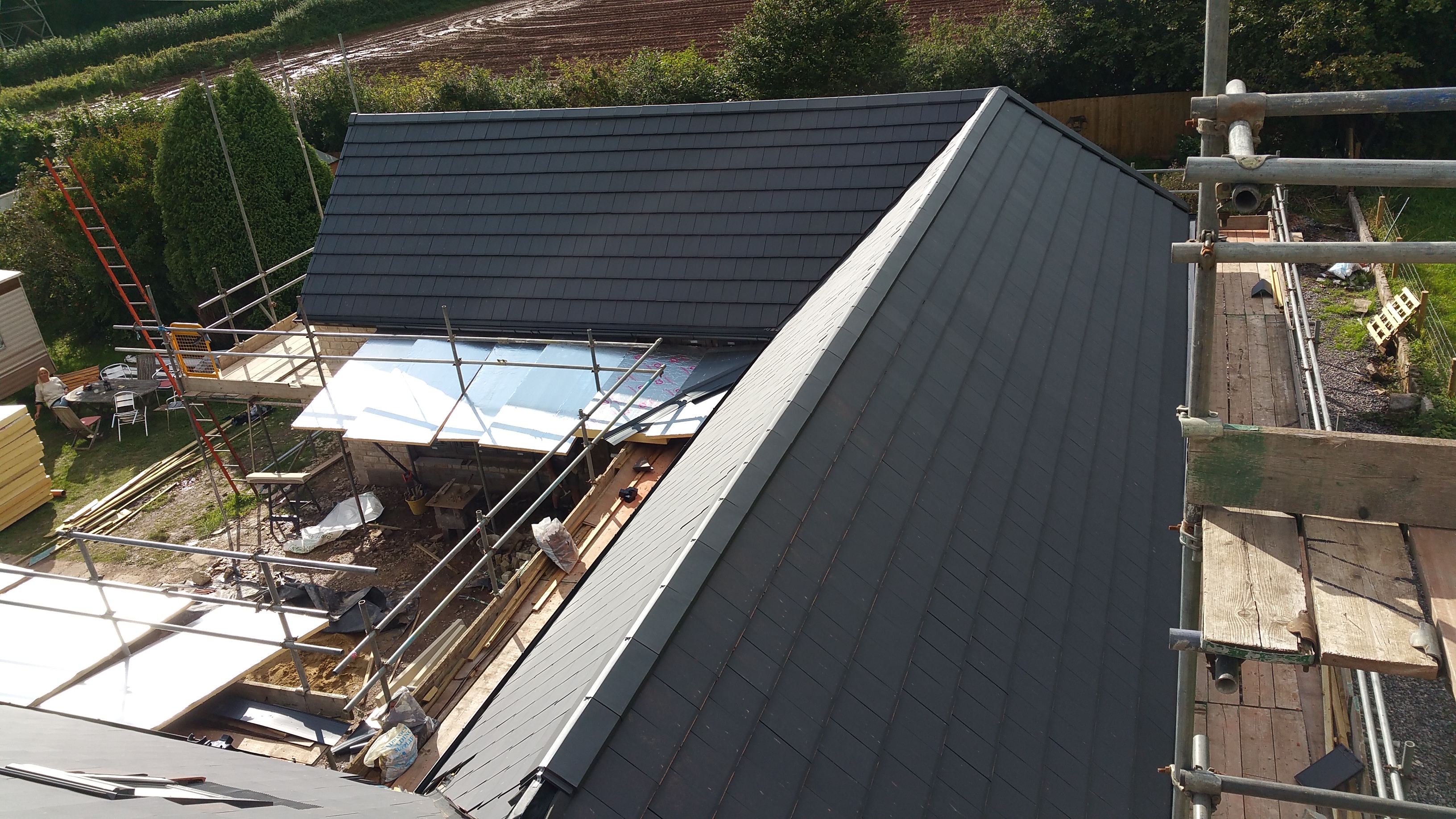 Verea smooth slate clay tile on large self build house roof