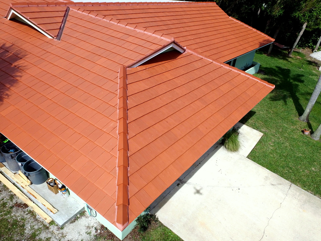 Galex Verea clay tile in natural red with continental style ridge tiles