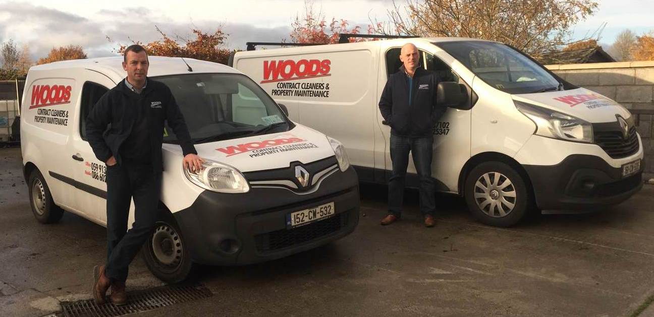 David and Pat with two of the fleet of Vans