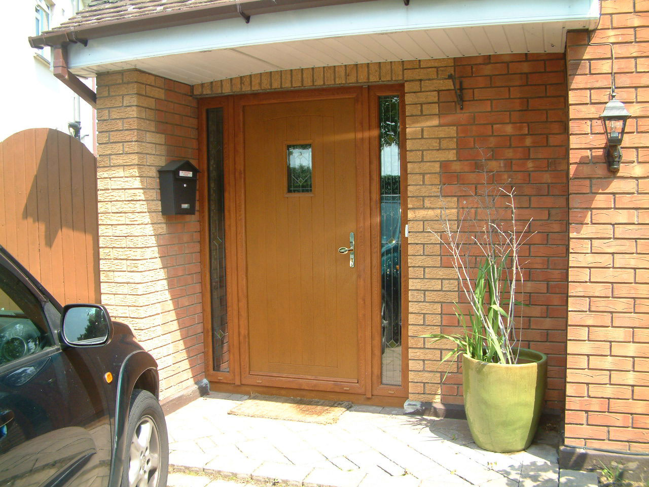 APEER OAK COMPOSITE FRONT DOOR FITTED BY ASGARD WINDOWS IN DUBLIN.