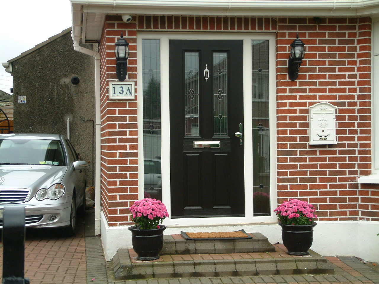 APEER APM2 BLACK DOOR WITH WHITE FRAME FITTED BY ASGARD WINDOWS IN DUBLIN 11.