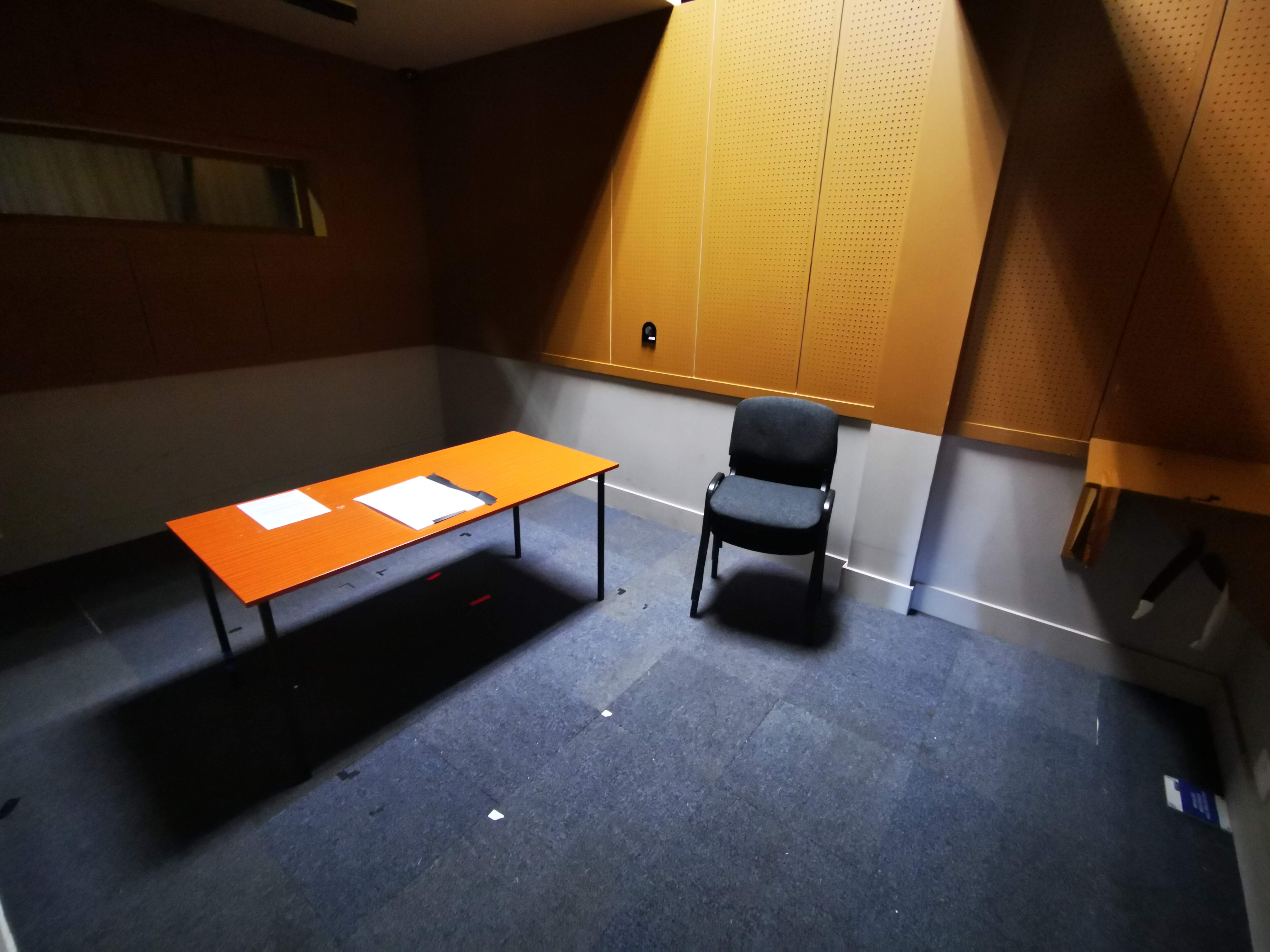 A purpose built interview room - NB fake glass window on top left to allow for shooting into room
