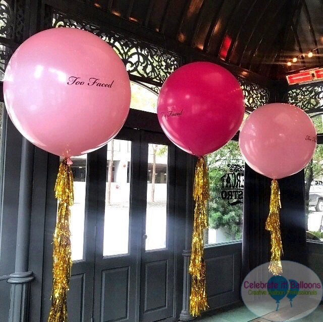 3ft balloons with Two Faced logo and gold tassels