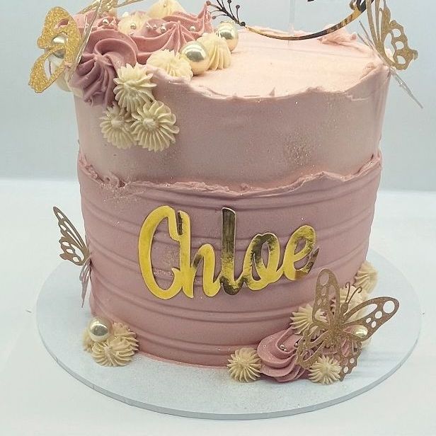 Pink Elegance: Beautiful christening cake adorned with gold butterflies