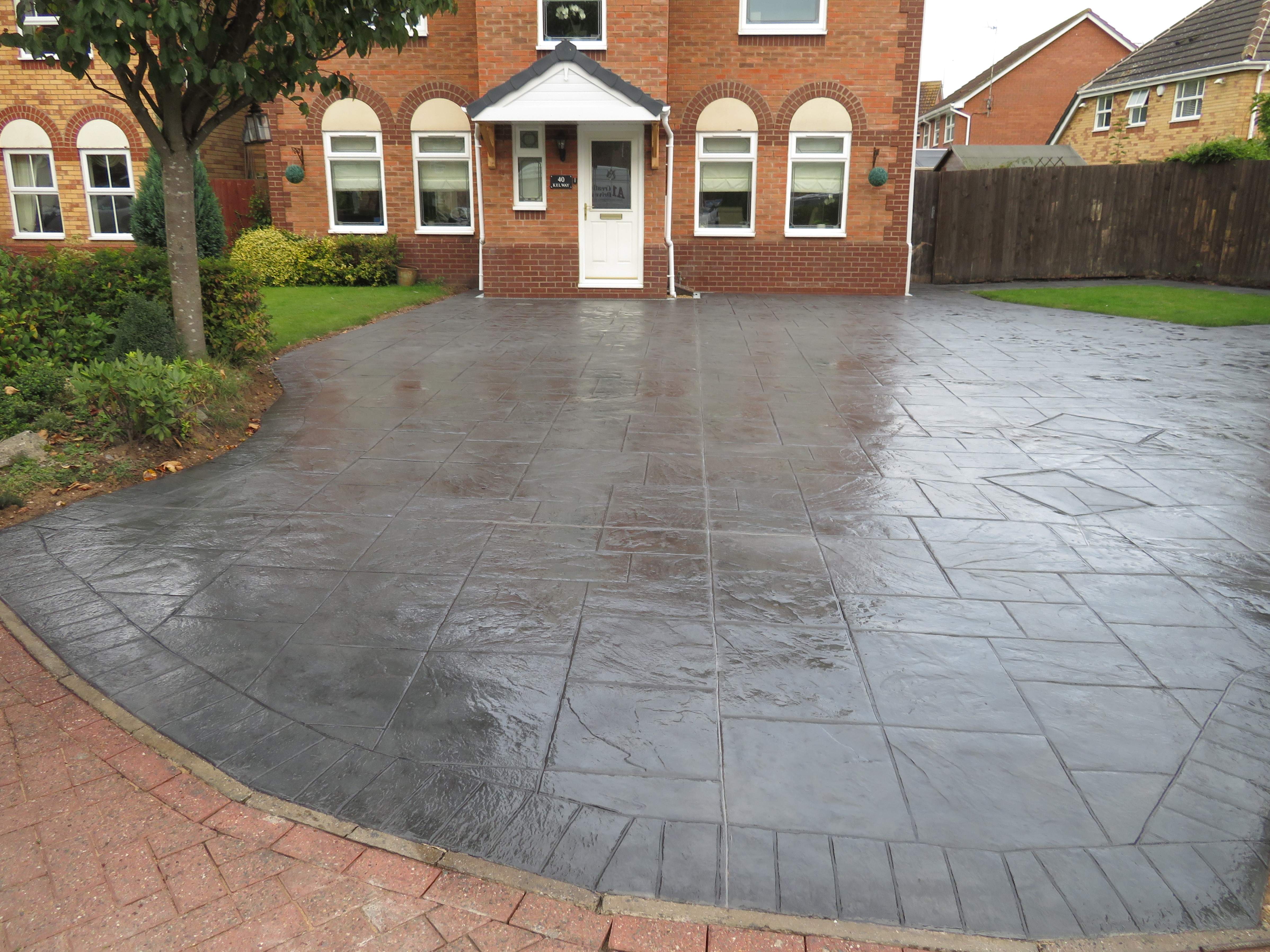 Pattern Imprinted Concrete Driveway done in Ashlar Pattern with Brick Boarder