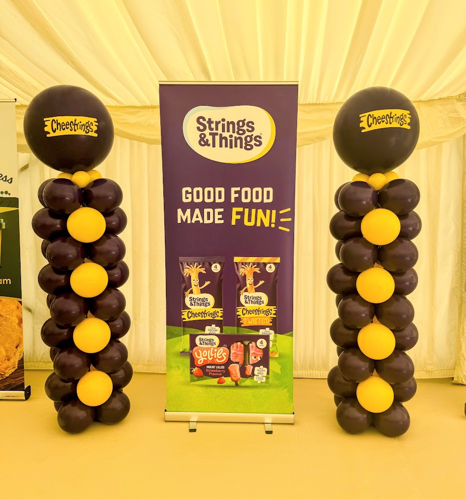 balloon pillars with cheesestrings logo attached