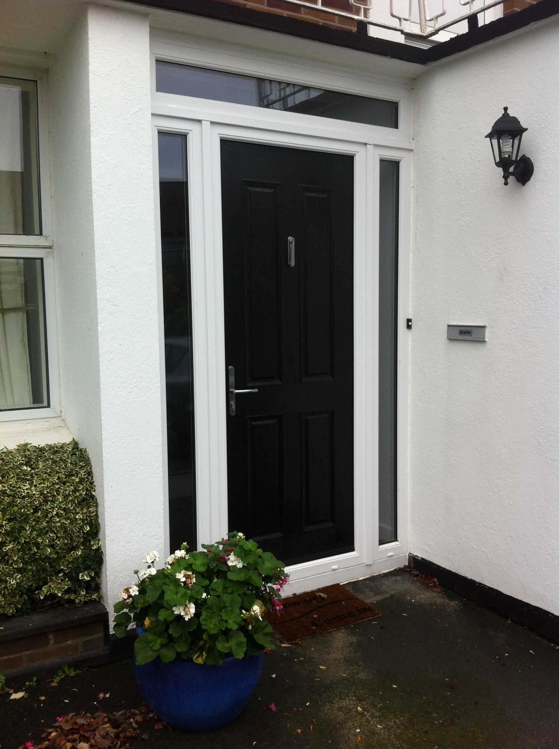 BLACK APEER APL1 COMPOSITE FRONT DOOR 
WITH WHITE FRAME FITTED BY ASGARD WINDOWS IN DUBLIN.
