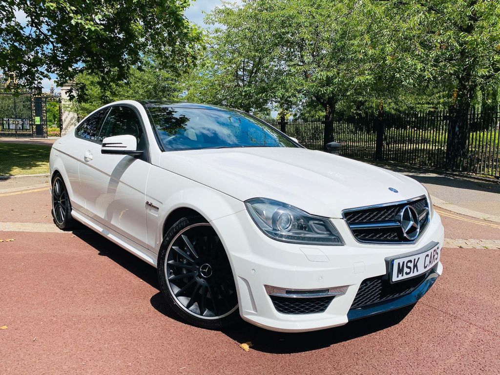 Presented in factory White with an Immaculate Ivory and Black two tone leather Interior