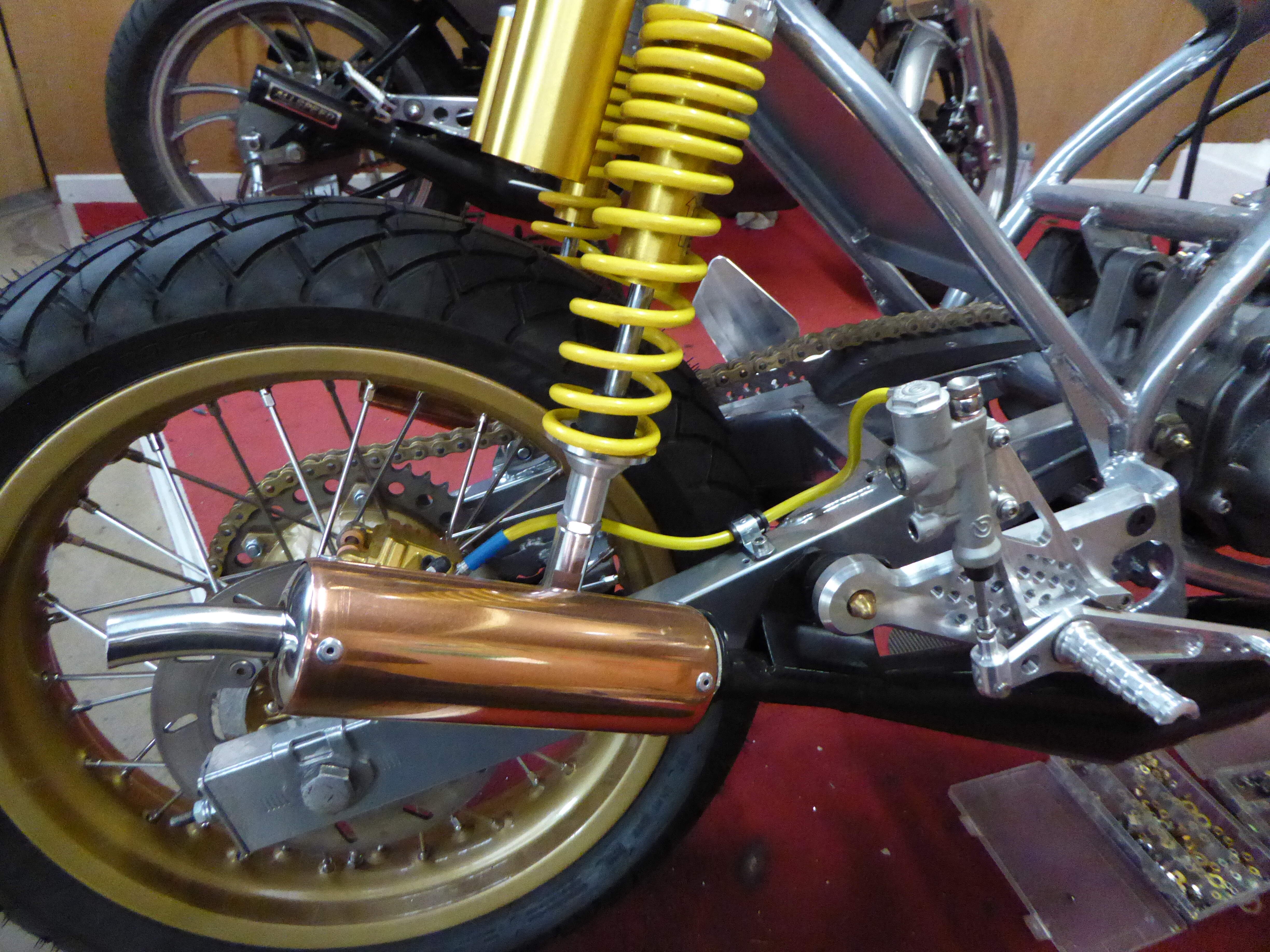 twin shocks , bespoke rear brake and copper cans