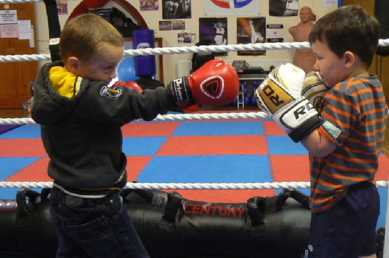 Two junior boxers sparring
